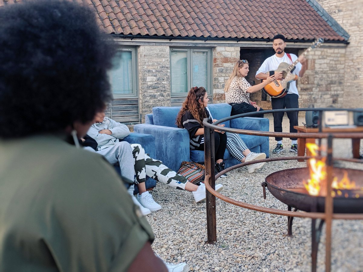jumpkwmc's tweet photo. Some impromptu singing around the fire after everyone's coaching sessions. The way this group have bonded in such a short amount of time is beautiful to see #SoundWaveRetreat https://t.co/gpGetPglFH