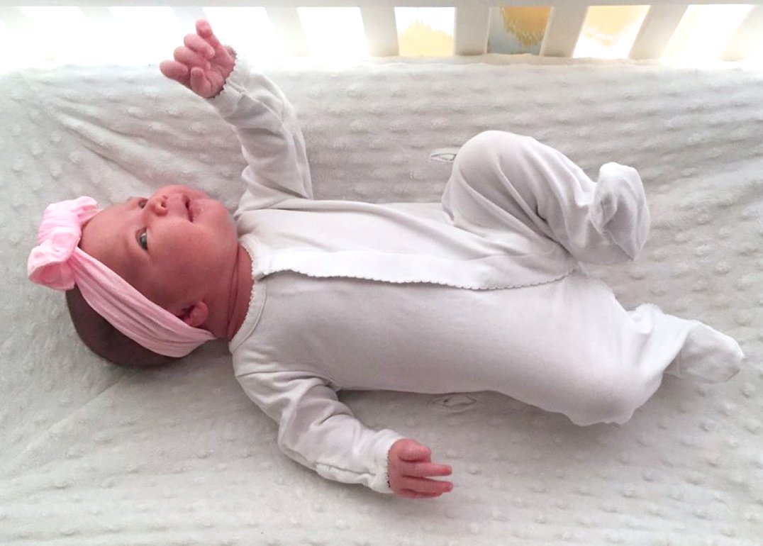 Getting in those morning stretches! Baby girl is looking oh so cute in her simple and sweet Kissy Kissy Basics footie🎀 Thanks @alysonstrohphillips for sharing! #kissykissybaby #babybasics