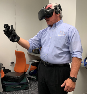 TalentQuest's tweet photo. Frank Merritt, CEO, #TalentQuest, just had the chance to try these uber-cool haptic gloves from @VRGluv. As innovators in VR and Immersive Training, we’re excited to test the extent of augmentation these gloves will allow. 
#VR #VirtualReality #CoolTech #VRTraining https://t.co/fwOrystp8Z