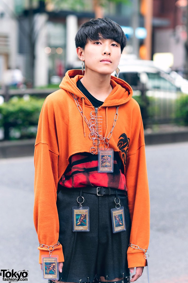 TokyoFashion's tweet photo. Tokyo high school student Makoto on the street in Harajuku wearing a remake style with Yu-Gi-Oh! Cards as accessories, a remake cropped painted hoodie, cutout pants &amp; Dr. Martens shoes #原宿 https://t.co/7tiiQsAJue https://t.co/jocXSbEJbd