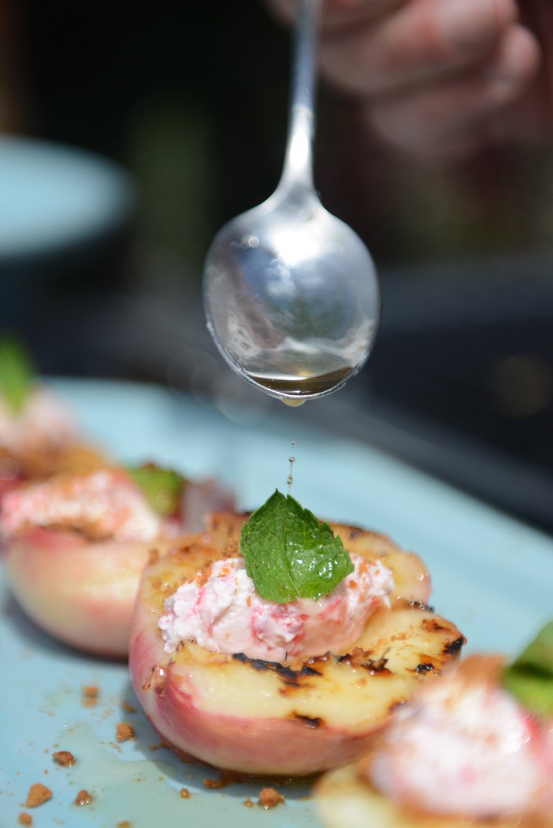 Hampton Court Flower Festival 2019 🌺
Rum &amp; honey BBQ peaches served with mascarpone raspberry ripple and cinnamon biscuit crumb 🔥 
Photo by @AndrewFlorides 📷