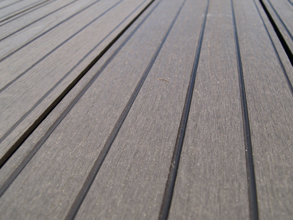 Our natural plastic composite deck boards have an embossed wood grain patterned side and a more traditional looking all grooved lined side. This maintenance free deck board is rot, U.V. and slip resistant. They have been pre-sanded to further enhance the natural look.