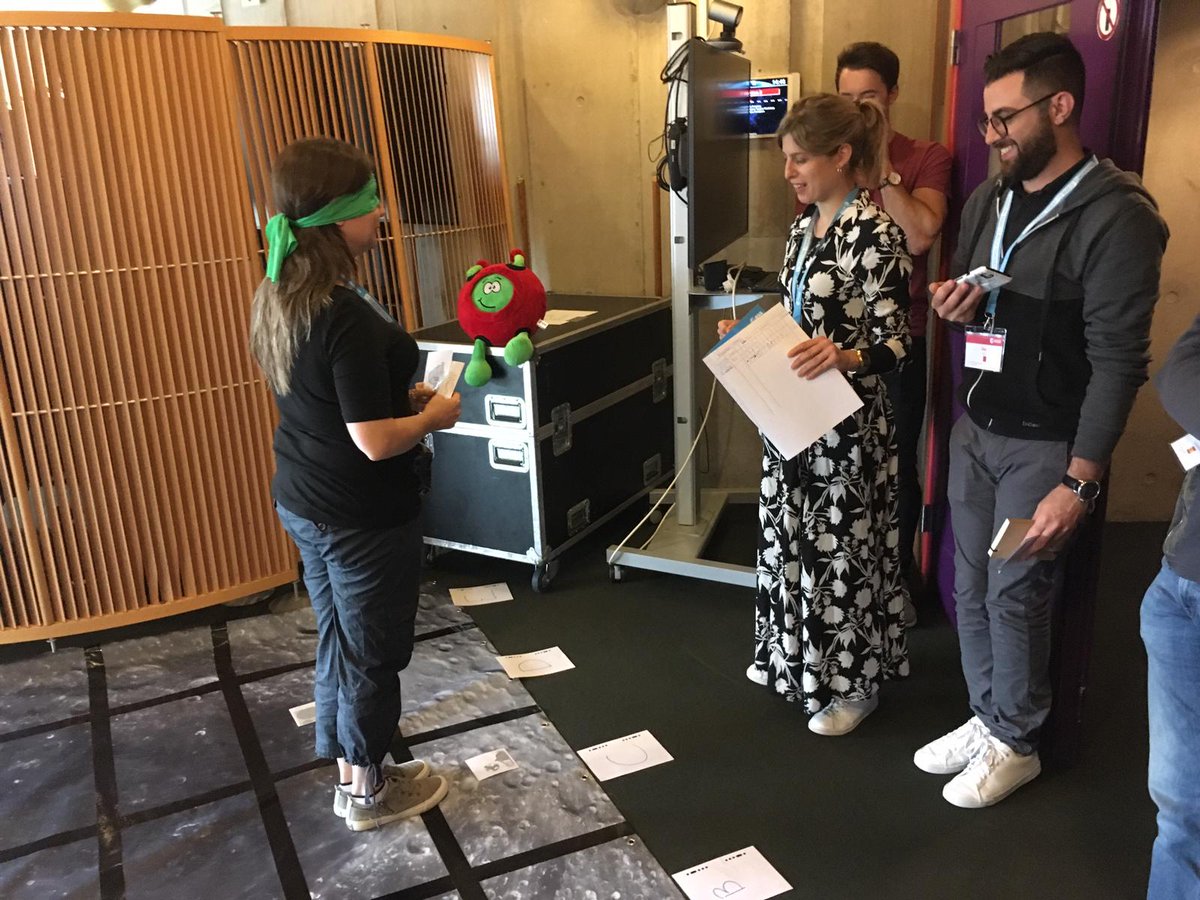ESA__Education's tweet photo. Getting hands on! Teachers are training for a mission on the #Moon by programming a “rover” to carry out objectives and avoid hazards. It's tricky! @Paxi_ESAKids is cheering from the sidelines #STW2019 https://t.co/IiESIX4zgY