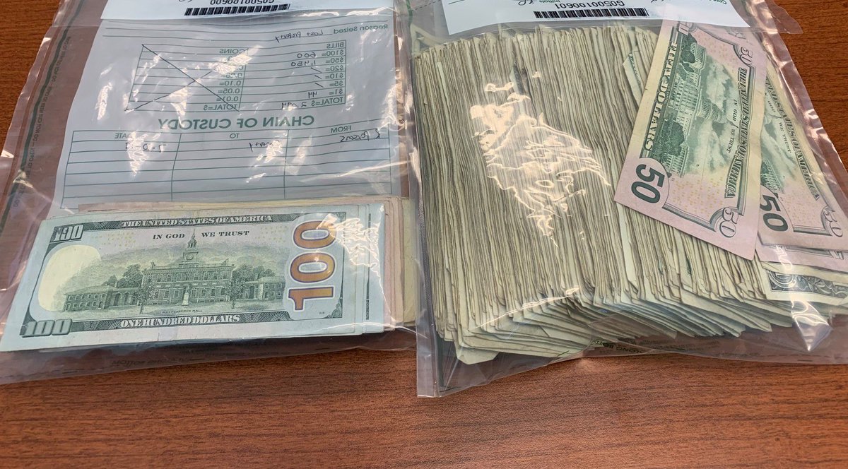 Closeup of money bags filled with cash returned by those who found it on I-285.