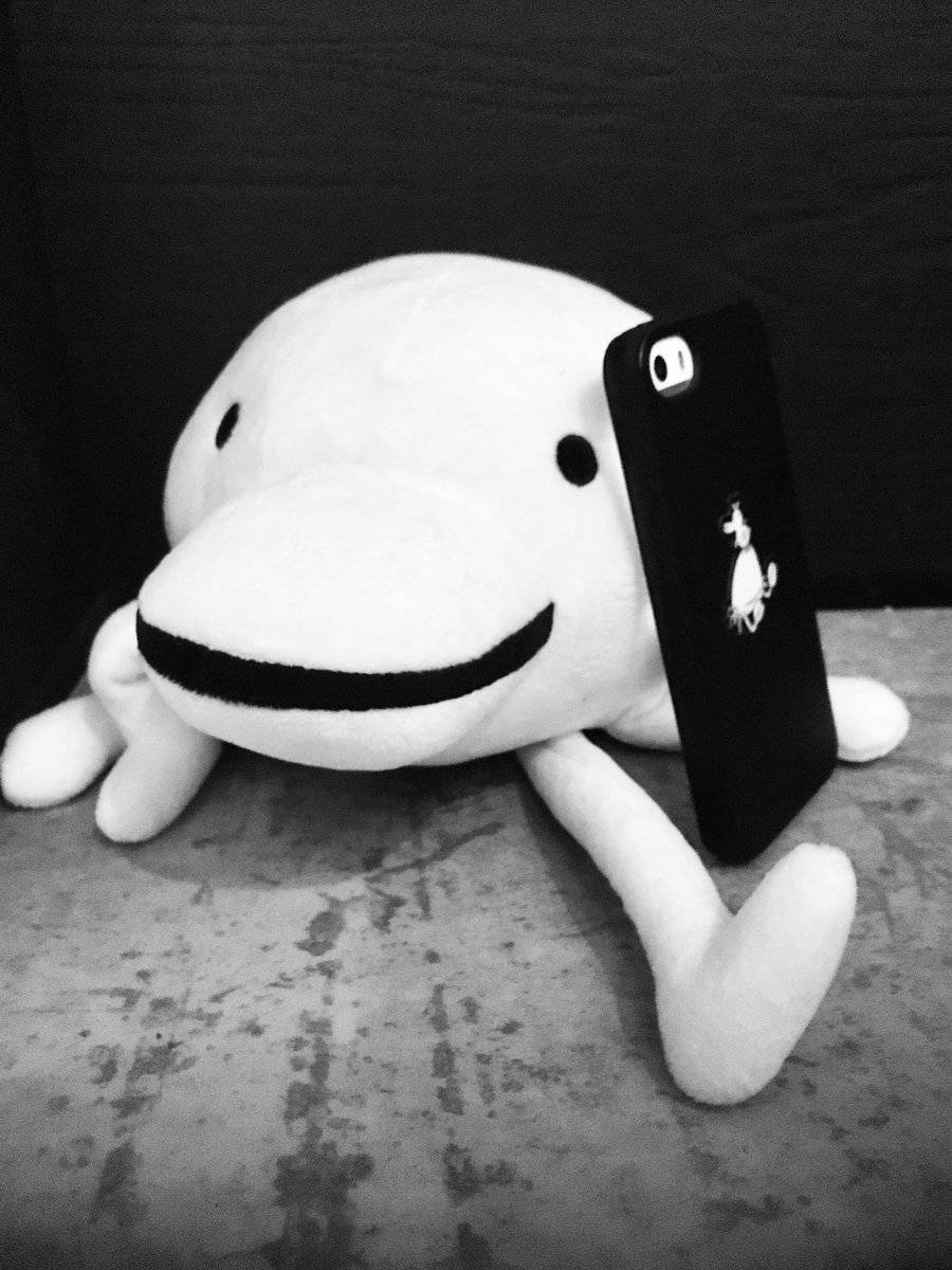 Minit plush having a phone call.