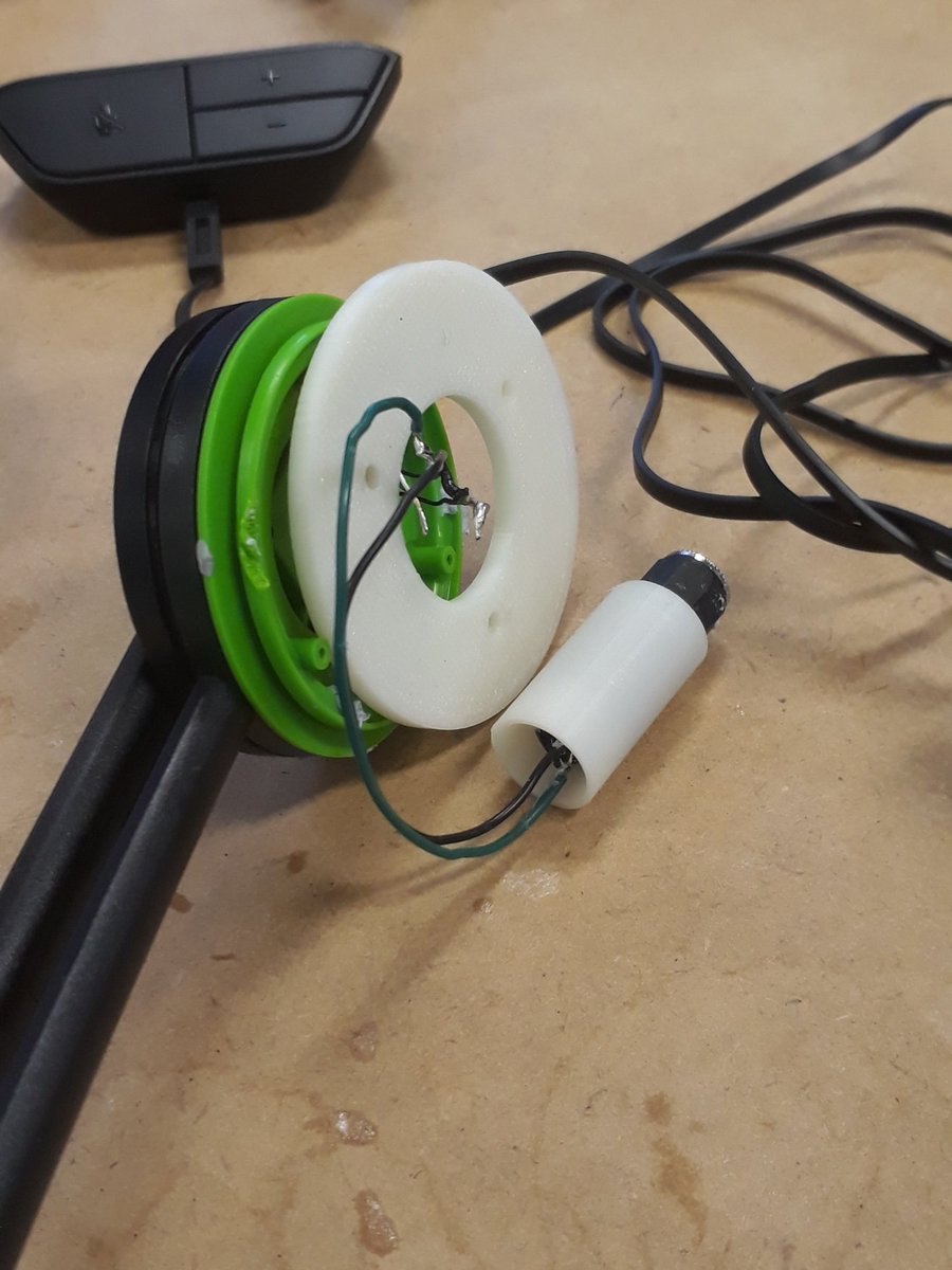 NickAGBruce's tweet photo. @nohandsnoexcuse @brycej When you're happy with a draft model print that you decided to hotglue it to the prototype for tonight's gaming session!
Obviously there's tweaks needed to the model before I can say I'm done with it π #progress #CochlearHeadset https://t.co/v07doRxtFk