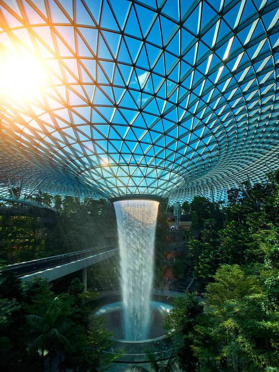 #Jewel at the Changi Airport, is a nature-themed entertainment and retail complex on the landside of Changi Airport, Singapore. This centrepiece is the world's tallest indoor waterfall, named the Rain Vortex, which is surrounded by a terraced forest setting. #shotoniphone