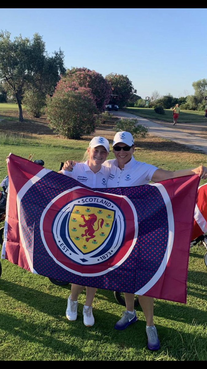 <a href="/ShazzMcWilliam/">Shazz</a> and I using the footy flag this week to hide from the sun at the Euro Team Champs in Sardinia! It is so hot 😎 We were wondering if @Kerr5Shelley fancies a wee hit sometime? 🏌🏻‍♀️⚽️