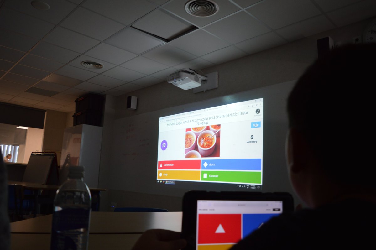 ASBEnglish's tweet photo. In their unit on "Food Around the World," Class B3 is learning about typical foods from different countries. Pictured below are students playing an online learning game, Kahoot, using the iPads to respond in teams. May the best team win! https://t.co/DwU1NBdoGL