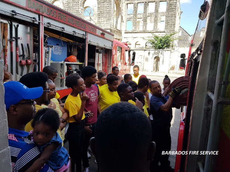 Happening Now: Twelve adults and forty-three children from the Newbury Church of the Nazarene Summer Camp, Newbury, St George are on tour at the Bridgetown Fire Station. #Barbados #BarbadosFireService #SummerCamp