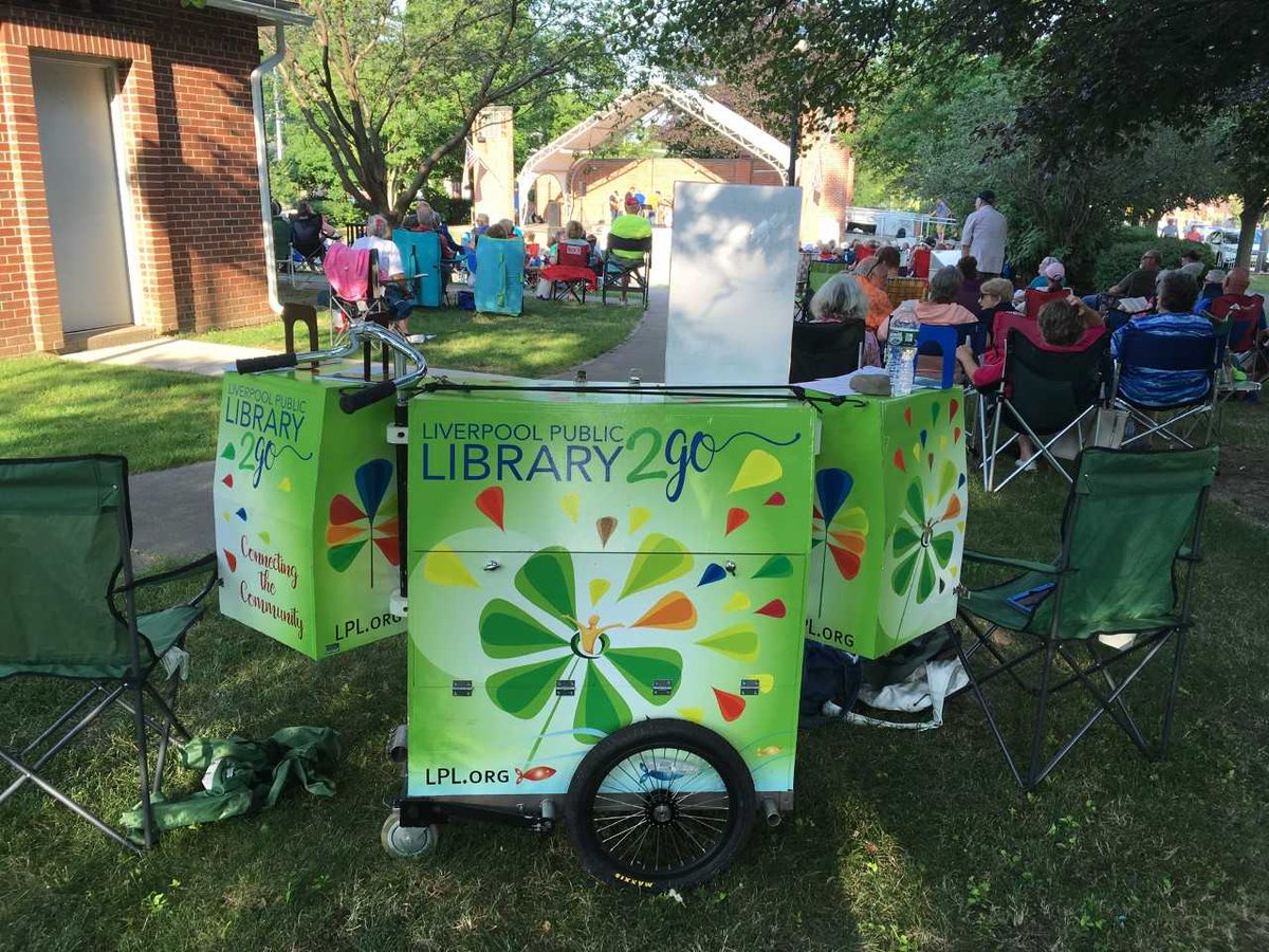 LiverpoolPubLib's tweet photo. #LPL2Go Book Bike Cart was out and about for big show in #JohnsonPark on lovely evening of Wed 7/10.
#BeatleCuse fans were able to check out items from our collection pinned to John, Paul, George and Ringo.
#PopUpLibrary visits again at 8/5 and 8/14 concerts. https://t.co/sXNWjCZwbu