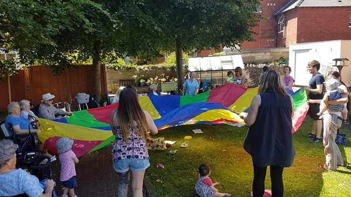 We had fab fun with our parachute in the garden at Morel Court #Penarth today. #intergenerational