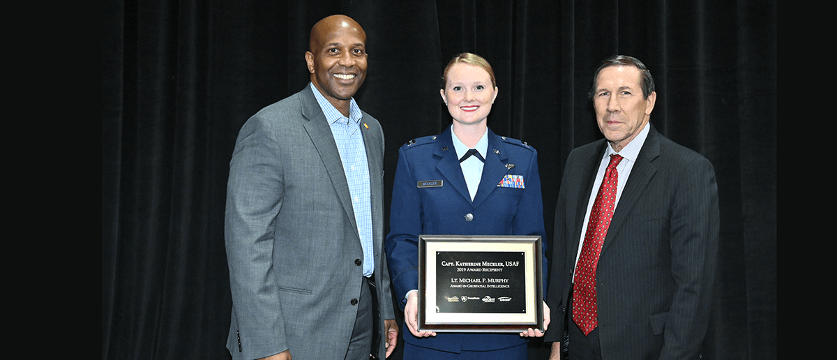 GEOINTsymposium's tweet photo. The Lt. Michael P. Murphy Award was presented to @usairforce Capt. Katherine Meckler at #GEOINT2019 https://t.co/ldv5KAlCQJ @Maxar @penn_state @psugeography @USGIF @tfraz06 https://t.co/N6oIzfycvQ