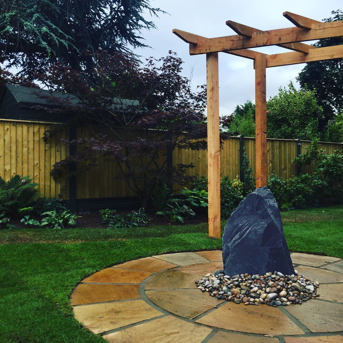 secretgardenweb's tweet photo. A couple of weeks ago this was an old, unused concrete pond.
The team have completed this stunning #gardendesign today with a #slate #waterfeature #circularpatio and a #nativetimber #larch #pergola 🌿🐝💕 https://t.co/N5AP8RO5W7