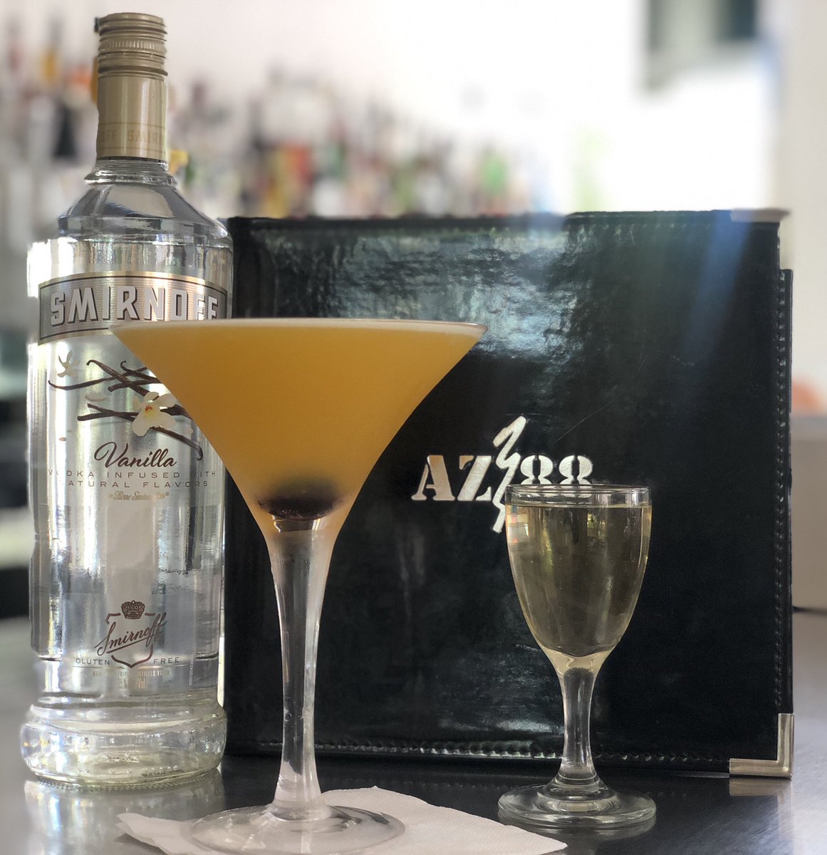 Smirnoff Vanilla, passion fruit syrup, lime juice and a luxardo  cherry all in a Martini. Don’t forget the shot of Champagne on the side! #diageorep #smirnoff #MartiniTime