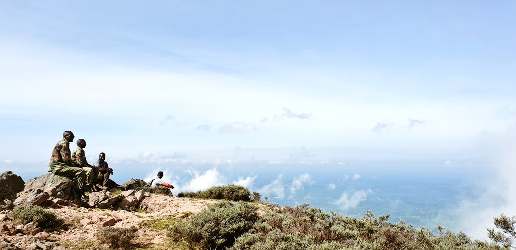 Good morning! An early morning hike up Chemurgoi Hill before heading to W. Pokot. Literally upon the clouds.  @lets_drift checks out Cherangany Hills and  @dgichuru always wears the brightest