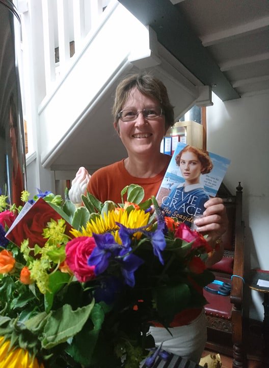 eviegrace2017's tweet photo. One very happy author! Thank you very much for the beautiful flowers and goods wishes for #TheSeasideAngel. @arrowpublishing @cassdibello Evie x https://t.co/ZR4hGmXGOf