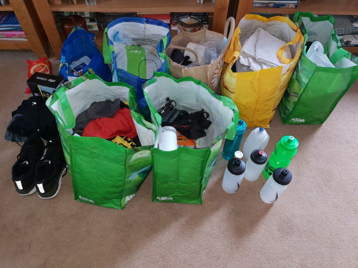 LunAndyDog's tweet photo. @JamesSCassidy1 I took a less scientific approach... open cupboard of running gear and empty into bags. There's some order here by 9AM on Sunday the crew will have it figured. #Edinburgh24 https://t.co/S2bsTZlilS
