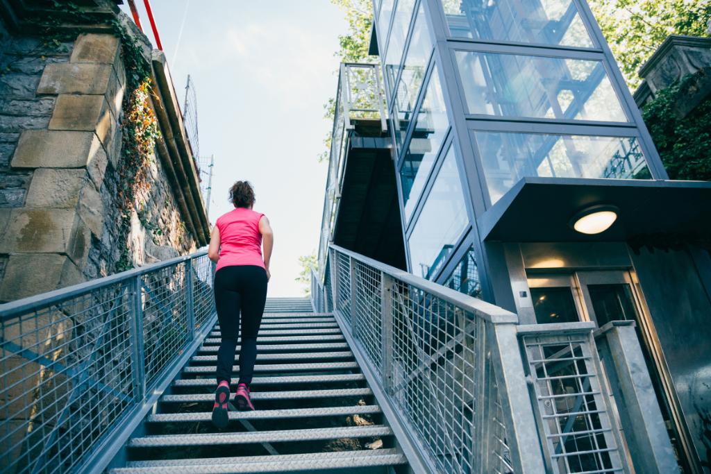 Woman jogging up stairs