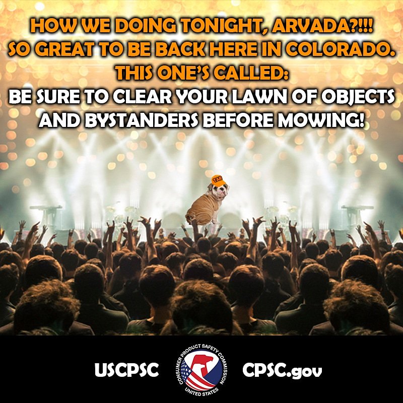 A dog named turn around randy on a stage. The text reads: how we doing tonight, Arvada? Be sure to clear your lawn of objects and bystanders before mowing!