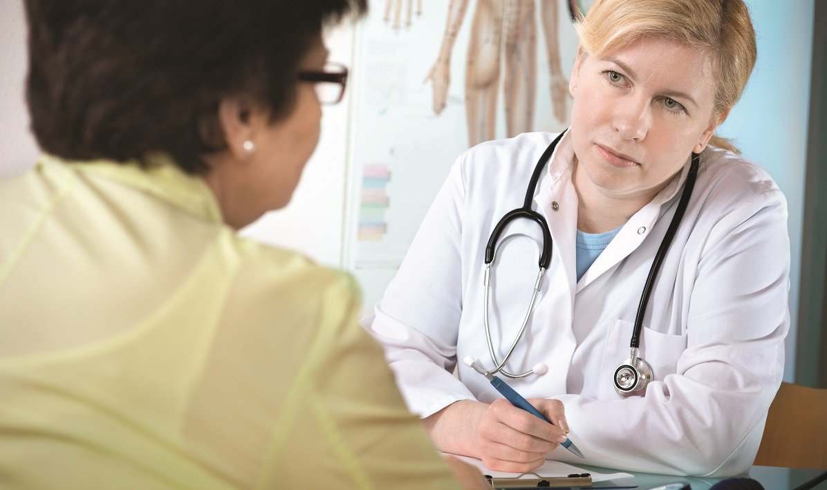 woman doctor speaking to woman patient