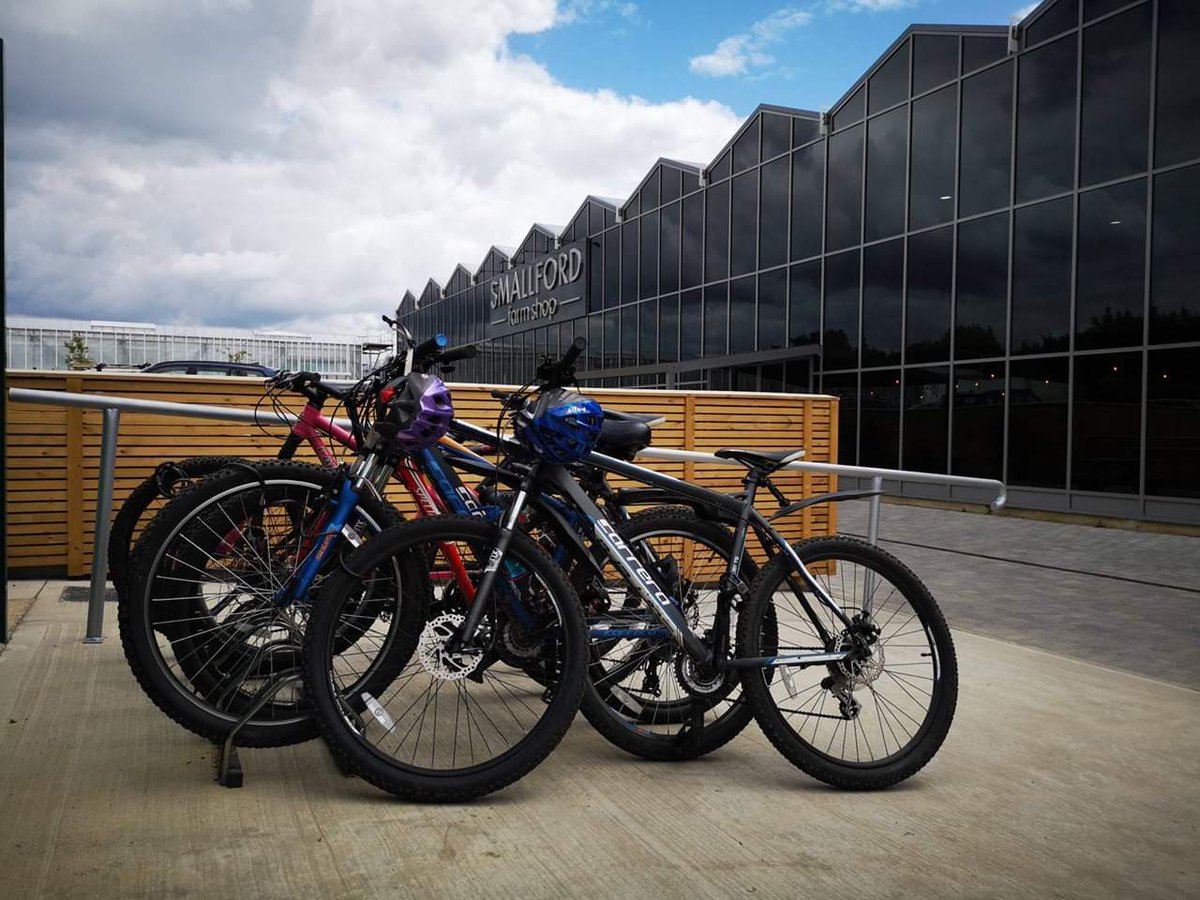  Bikes in a bike rack outside cafe 
