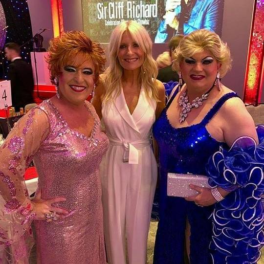 musichalltavern's tweet photo. Thursday night saw Mrs T and Peggy in London at the Sir Cliff Richard celebration dinner in aid of @VarietyGb . The evening was hosted by the gorgeous @GabyRoslin at an amazing night of Glitz and Glamour! We even got a few pics with the guest of honour himself! #MHT #CliffRichard https://t.co/wGc5LF68Uh
