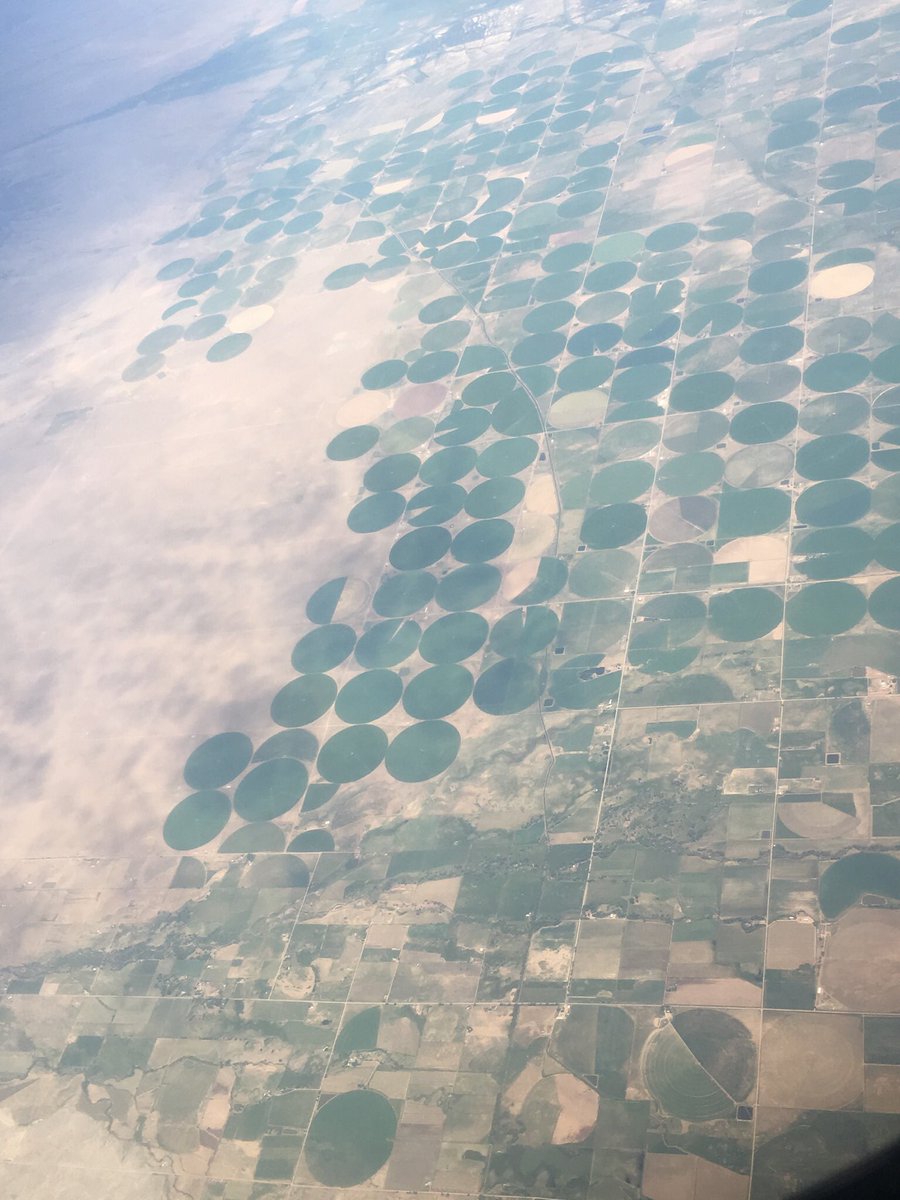 MrsMTLC's tweet photo. Such fun flying over the Midwest and seeing this! Farmland in these amazing shapes (my kids were eager for me to take pics for my ‘kids’)! Why the circles -  is what I wonder!#rpsummer19 #engagemath https://t.co/qQSdlIooVO