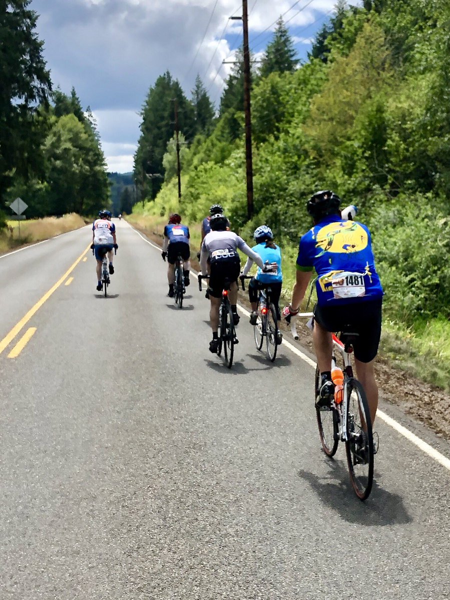 theolyroller's tweet photo. At today’s Seattle to Portland bike ride I came across this group.   We were at about the 125 mile mark and I watched the man in the couple ahead frequently and lovingly reach out to assist his partner. Heartwarming. #Seattletoportland https://t.co/lkH9GkPKlP