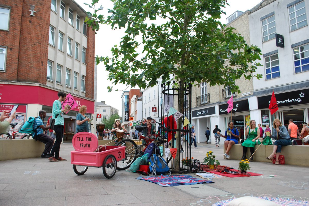 XRChelmsford's tweet photo. XRC rebels took part in their first local action yesterday! Rebels gathered to #TellTheTruth about the climate and ecological emergency, plus the pink cart (inspired by the #pinkboat at #internationalrebellion) made its first appearance! 💚🌸 #ExtinctionRebellion #localrebellion https://t.co/QNOJuorKBd
