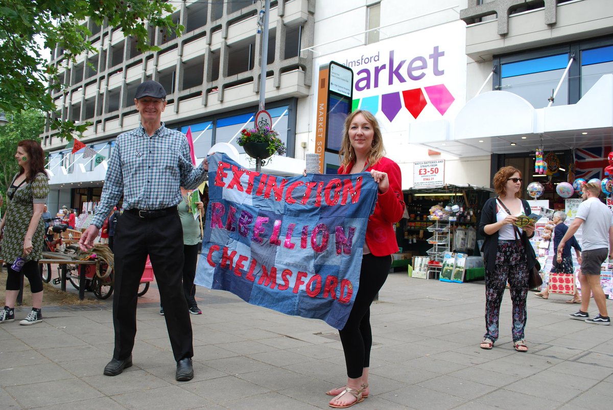 XRChelmsford's tweet photo. XRC rebels took part in their first local action yesterday! Rebels gathered to #TellTheTruth about the climate and ecological emergency, plus the pink cart (inspired by the #pinkboat at #internationalrebellion) made its first appearance! 💚🌸 #ExtinctionRebellion #localrebellion https://t.co/QNOJuorKBd