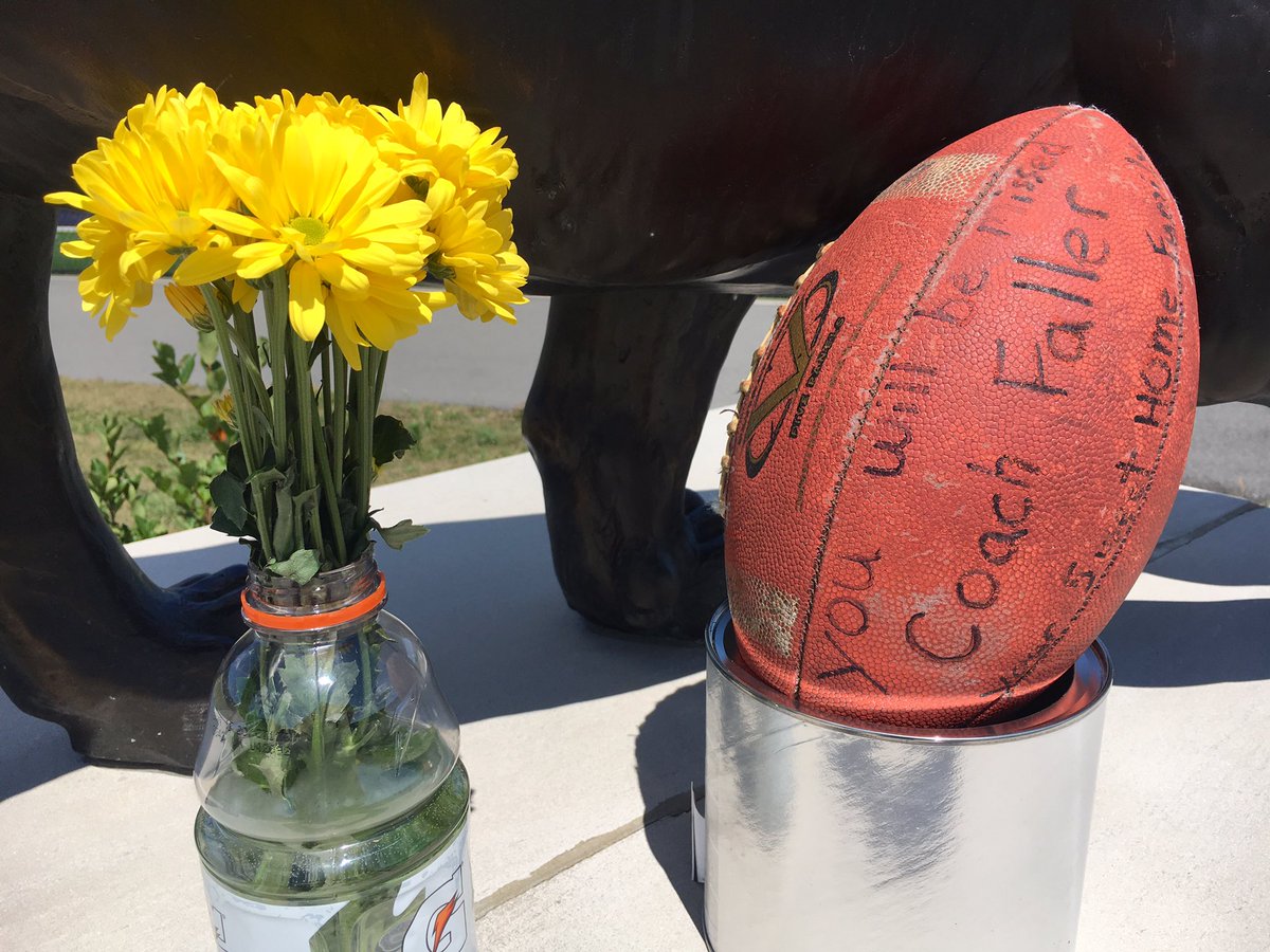 JTMessinger's tweet photo. A small memorial left at the athletic fields at Sweet Home High School for long time coach and teacher John Faller. On @WGRZ Sports at 6:20, how some are remembering him in their own words. https://t.co/sVNqCgnB7u