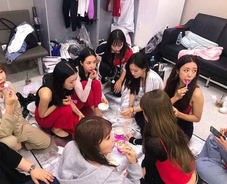 members gathered together with the staff to eat ice cream 