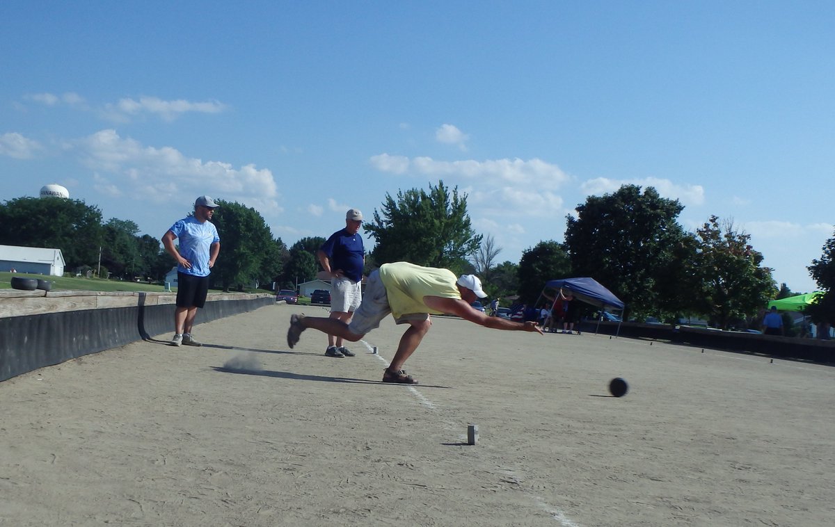 Marie1Culpepper's tweet photo. Jason DeBrower shoots his bolle at the Rolle Bolle World Tournament in Annawan, IL. Jason is a fourth-generation player who works hard to promote the game in the region. @UI_HPG @UIGradCollege  #rollebolle #IowaValleyRCD https://t.co/JvZmU4ljLE