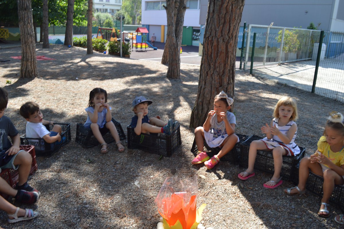 ASBEnglish's tweet photo. On Friday, K3 students brought their classroom outside where they were able to practice making (and eating!) smores by the campfire. Delicious!! https://t.co/iil5XL68Zu