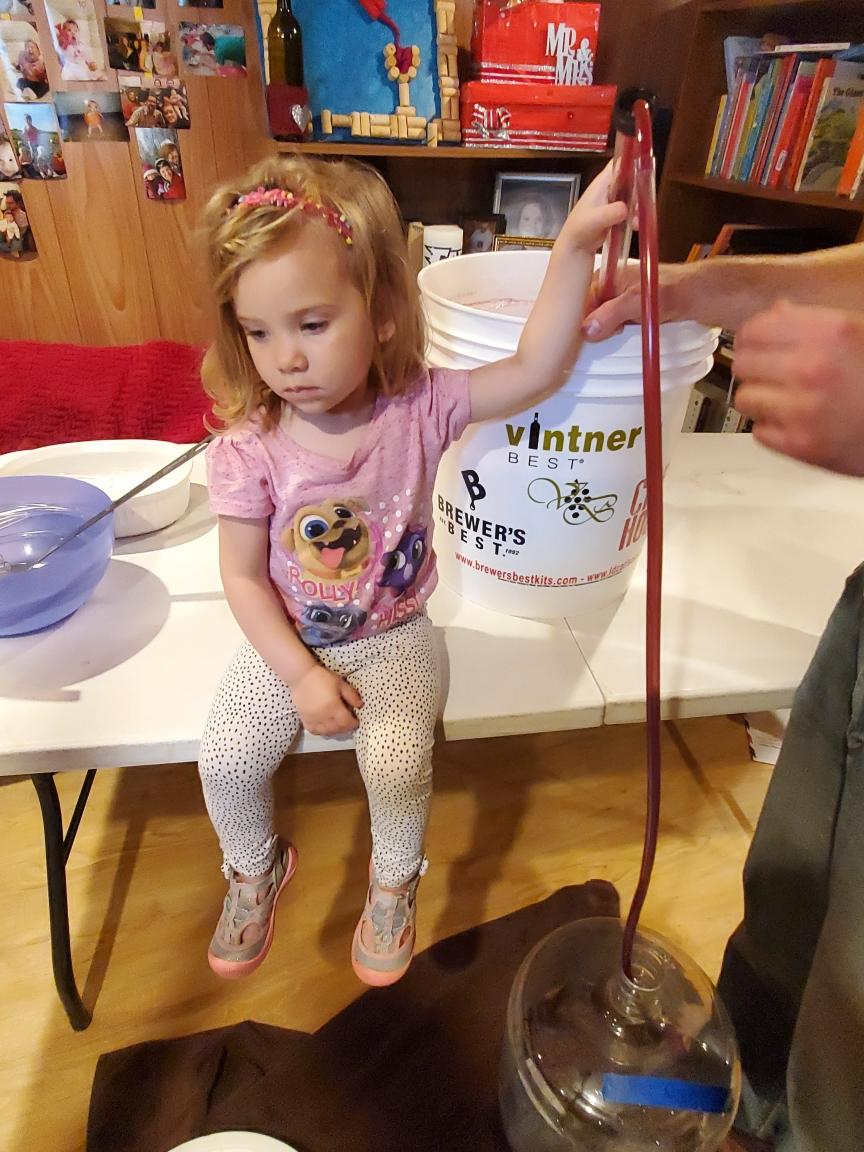 Our current batch of #homebrew wine has been moved from the primary to the secondary stage. Jenna was so happy to help until we told get she can't drink until 21. #familywine #stage2 #secondary #teaching