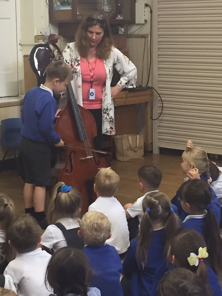 Miss Drumm came to our infant assembly to tell us all about string instruments.