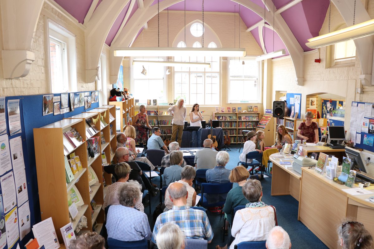 strettfest's tweet photo. #StrettFest This is Church Stretton Library with #Whalebone and Poet, Jean Atkin. The library was heaving as #Whalebone weaved their folk music magic to Jeans beautiful "Understories". https://t.co/Dt7vUdEicN