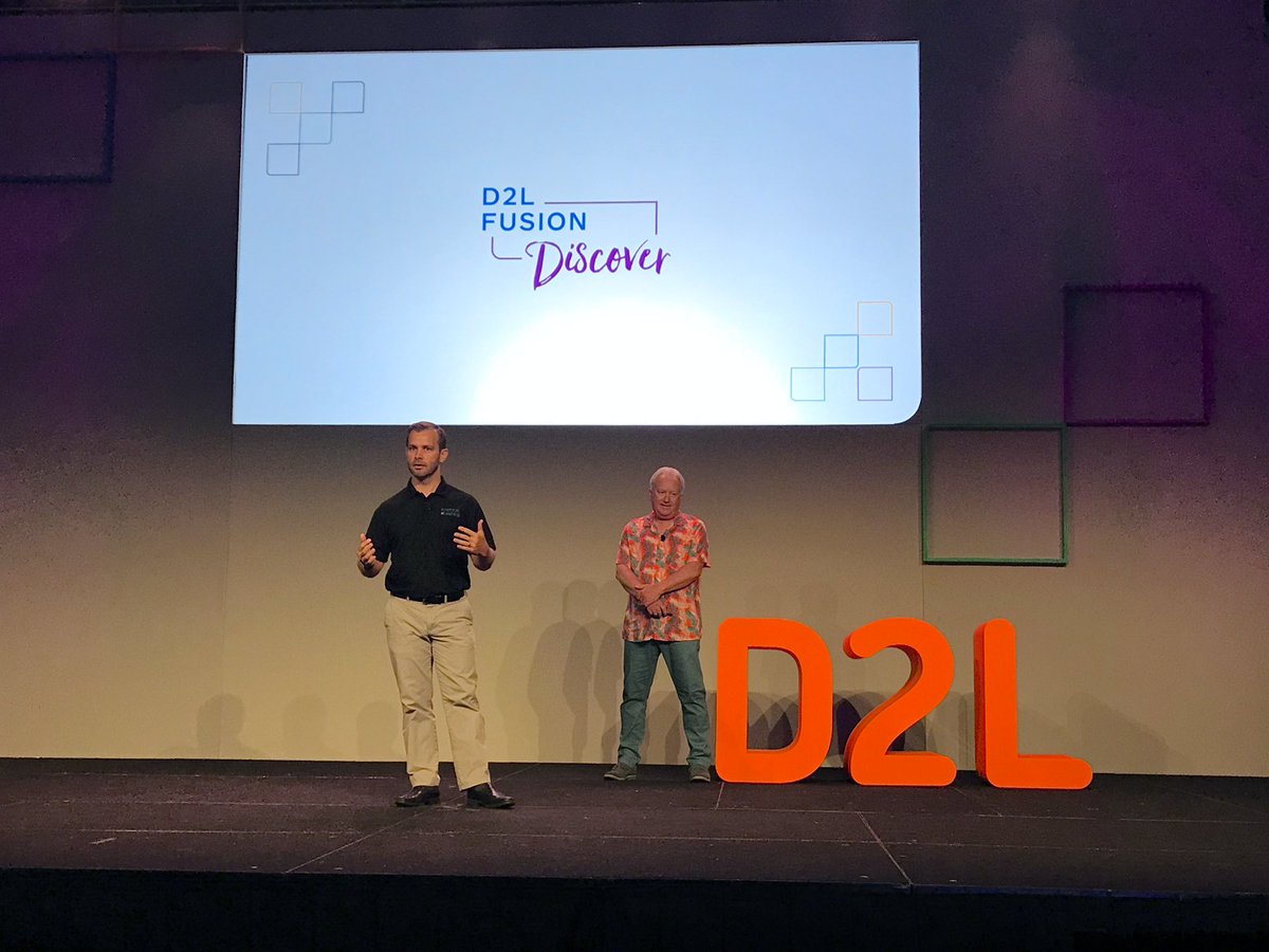 D2L's tweet image. Joining @D2LBarry on the stage is @mrjallison, representing @HWDSB_eLearning, who recently won a D2L Excellence Award! 🎉 #D2LFusion