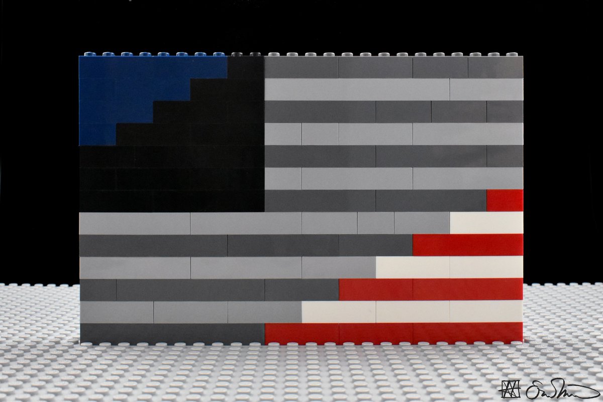 An American flag with the center converted to a gray scale.