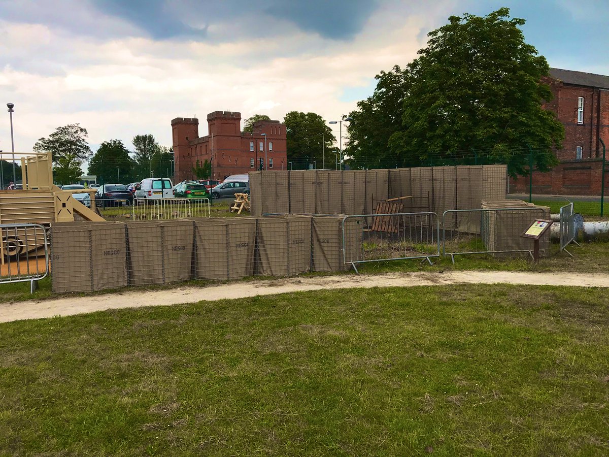 staffsregiment's tweet photo. The Hesco’s which were donated by @HESCOGroup for our #CampFisher project are up and we are now very busy filling them. Special thanks to @tippersbm Lichfield branch for providing us with the sand. Only 20 tonnes to shovel now! https://t.co/2yBogCe5tx