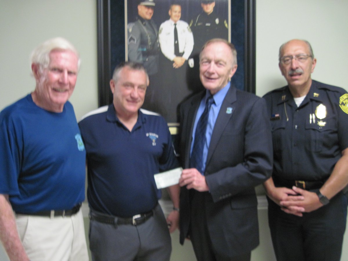 On 7-15-2019, at the Falmouth Police Department. Mass. State Police Sergeant John Kotfila gave Cops For Kids with Cancer a donation of $10,000.00 from the Bourne State Police Barracks. In photo. Bob Faherty, Sgt. John Kotfila, Bill Coulter and Falmouth Chief Ed Dunne.