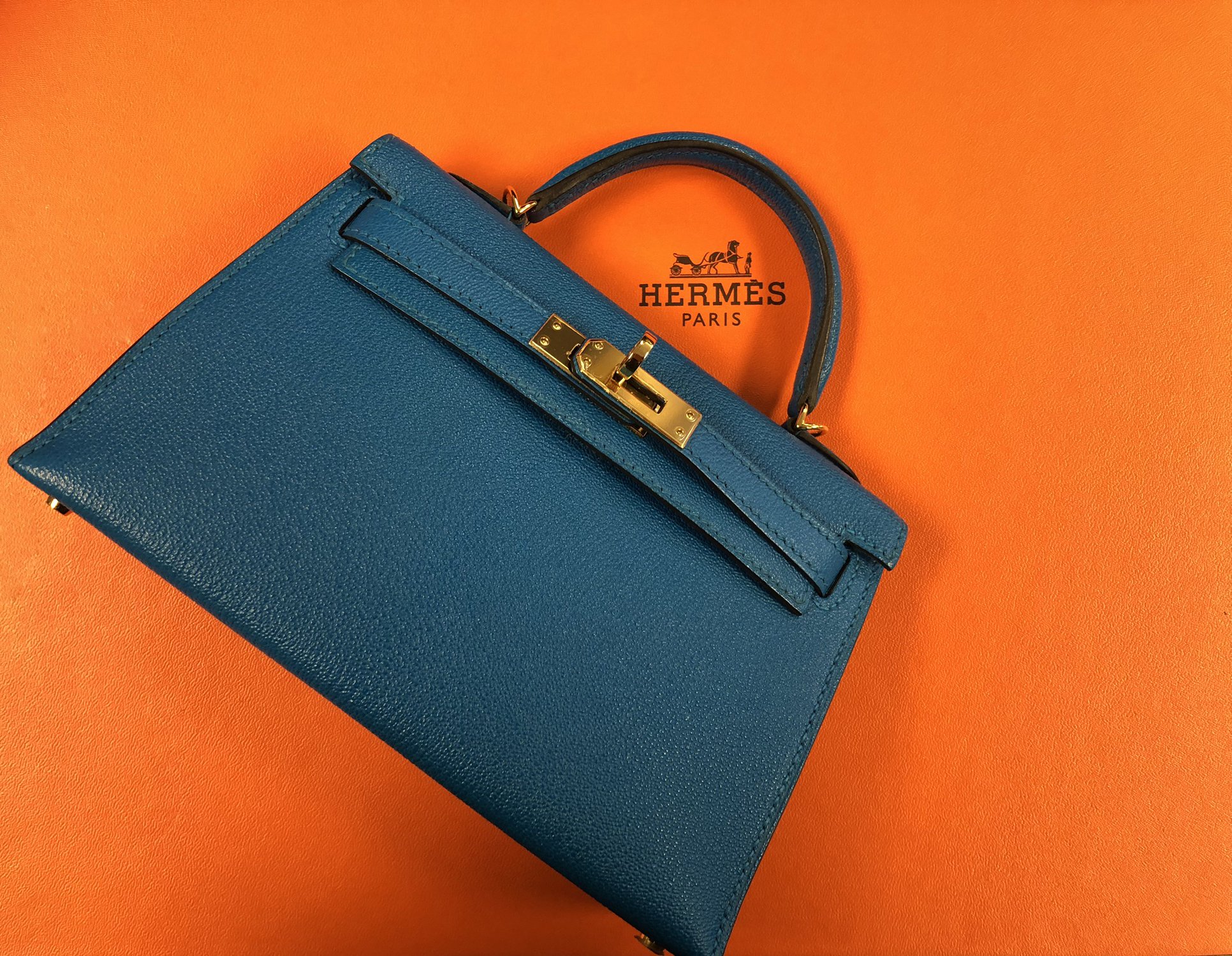 Heritage Auctions on X: A little Summer color - Heritage style. Hermès  20cm Blue Zanzibar Chevre Leather Mini Kelly II with Gold Hardware. Looking  for a little luxe? Mark your calendars, our