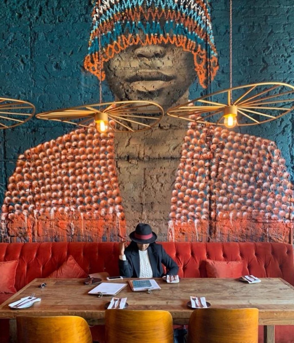so what was supposed to be a "SECRET MURAL" of ME at <a href="/socialparkwood/">Social Parkwood</a> has eventually surfaced thanks to <a href="/TumeloMolotoSA/">Tumelo Moloto</a>, <a href="/Thobi_M/">JoaanneTheScammmer</a> &amp; <a href="/IAmMulo/">Nhlamulo</a> 🤣. So when you do visit them at Cnr Bolton &amp; Jan Smuts Road in Rosebank and are lucky enough to have a seat at my table do take a picture.