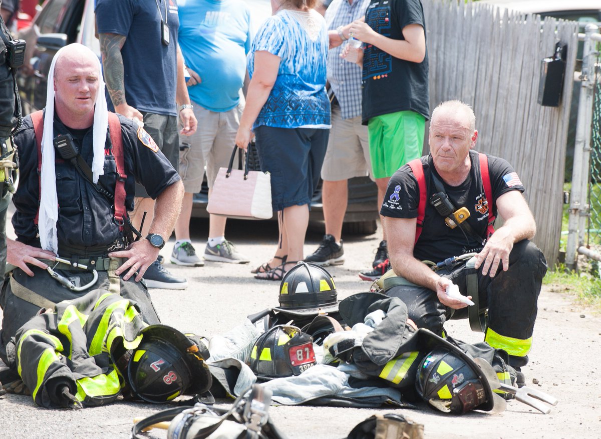 Lloydphoto's tweet photo. Photos: Staten Island Firefighters dealt with heavy fire conditions. A second alarm was called on arrival for two houses on fire. Firefighters take a moment to rest. #LloydMitchellPhotography #Firefighting #Fireservice #Weatherfeature #StatenIsland #Photojournalism #Journalism https://t.co/NWQPMaYrwZ