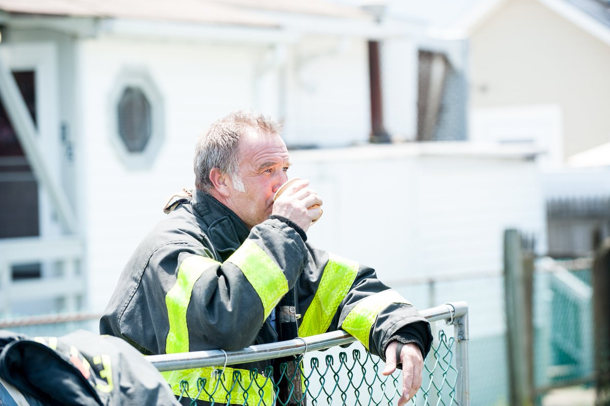 Lloydphoto's tweet photo. Photos: Staten Island Firefighters dealt with heavy fire conditions. A second alarm was called on arrival for two houses on fire. Firefighters take a moment to rest. #LloydMitchellPhotography #Firefighting #Fireservice #Weatherfeature #StatenIsland #Photojournalism #Journalism https://t.co/NWQPMaYrwZ