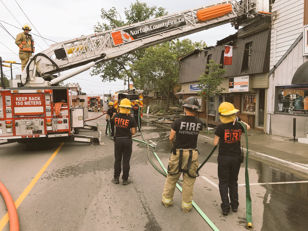 NorfolkCoFire's tweet photo. After Norfolk County firefighters worked hard battling a blaze in Port Dover this afternoon the awesome people at @SFA_Canada are here helping our crews clean-up. Thank you Southwest Fire Academy. https://t.co/imADPKMmgc