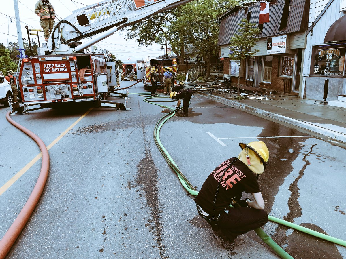 NorfolkCoFire's tweet photo. After Norfolk County firefighters worked hard battling a blaze in Port Dover this afternoon the awesome people at @SFA_Canada are here helping our crews clean-up. Thank you Southwest Fire Academy. https://t.co/imADPKMmgc