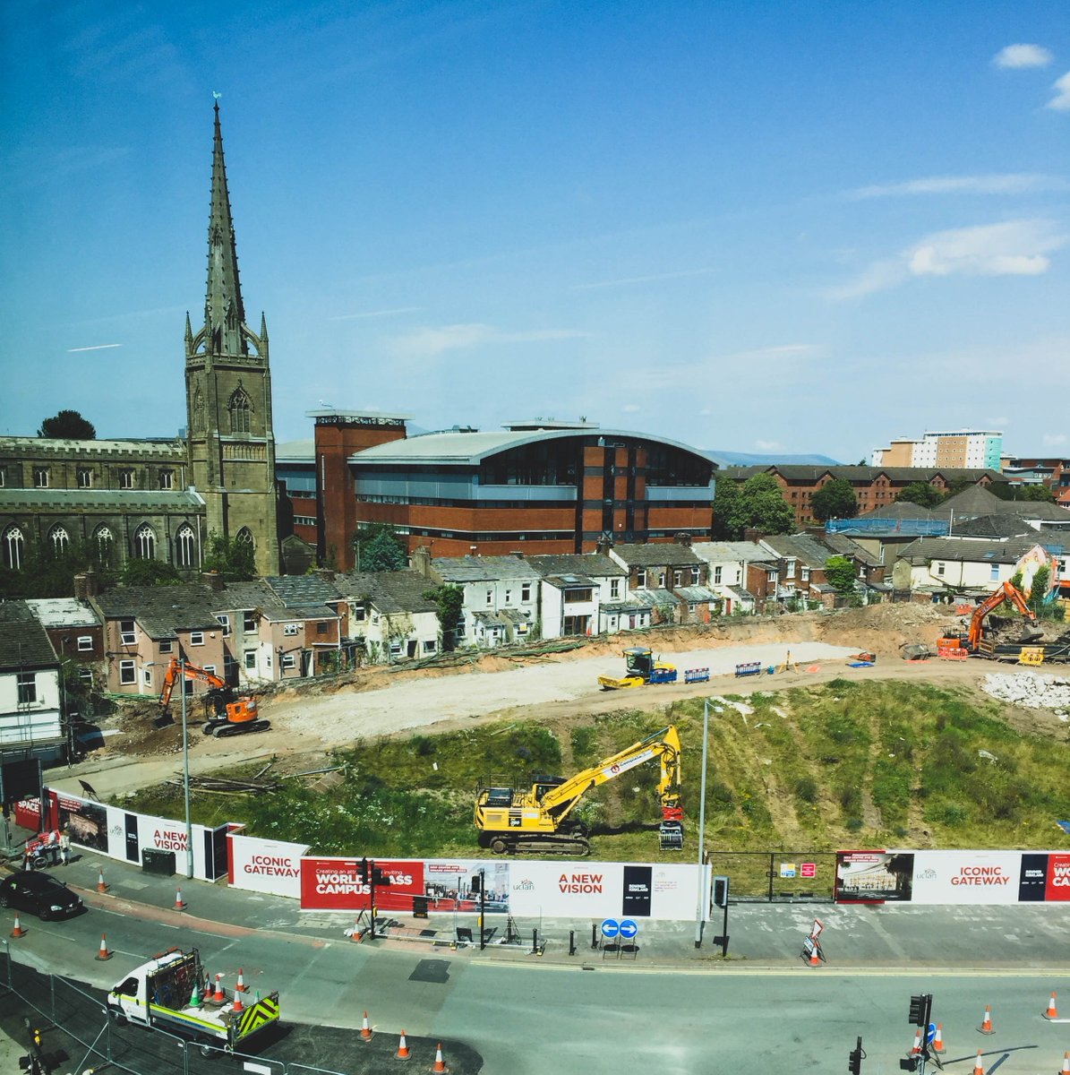 Great view down to @UCLan's @UCLanMasterplan new student centre and square site, where work is well underway to create an iconic gateway connecting the city of #Preston 🚧🏗️🚦

Hoardings looking great too. Designed by yours truly 👀🙌