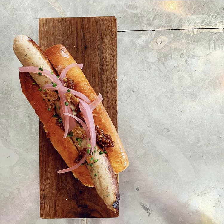 DArtagnanFoods's tweet photo. Happy #NationalHotDogDay! Check out St. Genevieve in Minneapolis, MN's unique "duck dog" made with our exclusive Rohan duck served on a milk bun with pickled onion and crispy duck skin. #DuckDog #HotDog #stgmpls #RohanDuck https://t.co/bLoPvOBfK8